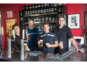 Co-founders of Village Brewery, Jim Button, Allan Merlo, Rob Bondi and Tom Stuart, are photographed at the brewery in southeast Calgary on October 2, 2014.