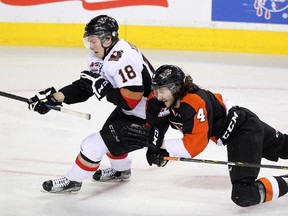 Calgary Hitmen star Jake Virtanen, seen battling Medicine Hat's Ty Stanton in  playoff action earlier this month, is a Vancouver Canucks prospect.