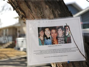 A photo of five young people hangs on a tree outside a Brentwood home a year after five were killed at the residence.