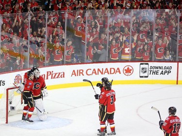 The Calgary Flames celebrate their win against Vancouver Canucks during Game 6 on Saturday night.