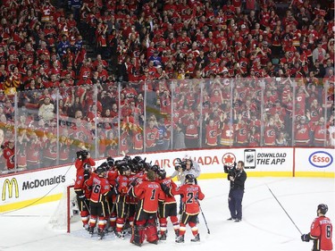 The Calgary Flames celebrate their win over the Vancouver Canucks during Game 6 on Saturday.