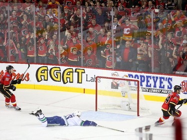 Calgary Flames forward Jiri Hudler, right, celebrates his goal on the empty Vancouver Canucks net during Game 6.