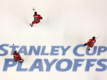 Calgary Flames Johnny Gaudreau, left, Sam Bennett and Drew Shore skate during warmup before game 6 of the NHL Playoffs at the Scotiabank Saddledome in Calgary.