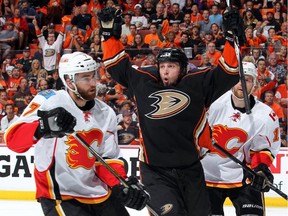 Matt Beleskey of the Anaheim Ducks reacts after scoring against T.J. Brodie #7, and Matt Stajan #18 of the Calgary Flames in Game 1 on Thursday.