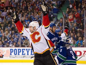 Flames veteran Matt Stajan celebrates teammates David Jones' goal against the Vancouver Canucks in Game 1 on Wednesday.