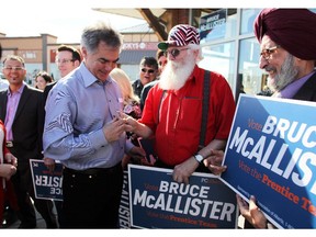 Premier Jim Prentice got handed a lollipop by Langdon's Eugene Jobson as he made a campaign stop at the headquarters for Chestermere Rocky View PC Candidate Bruce McAllister on April 17, 2015.