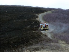 Dry conditions contributed to Calgary Firefighters fighting a grass fire at Nose Hill Park in Calgary, on April 11, 2015.