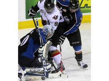 Christina Ryan/ Calgary Herald CALGARY, AB --APRIL 3, 2015 -- The Calgary Hitmen Pavel Karnaukhov against Kootenay Ice goalie Wyatt Hoflin in the opening round of the Western Hockey League playoff series at the Scotiabank Saddledome in Calgary on April 3, 2015. (Christina Ryan/Calgary Herald) (For Sports story by Christina Ryan) 00063969A SLUG: 0404 Hitmen vs. Kootenay 3