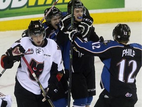 The Calgary Hitmen lose to the Kootenay Ice celebrate their win in Game 5 of the Western Hockey League playoff series against the Calgary Hitmen at the Scotiabank Saddledome in Calgary on April 3, 2015.
