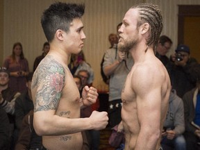 Calgarian Stephen 'The Dragon' Claggett, left, and 'Mighty' Tebor Brosch of Mississauga, Ont., are in a staredown after their Thursday night weigh-in ahead of their Canadian welterweight championship bout iat the Deerfoot Inn and Casino on Friday night.
