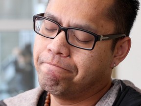 Erwin Manzano talked with the media outside the Calgary Courts Centre after Wilson Clorina changed his plea to guilty in the May 2013 murder of Manzano's wife Chona and five year-old son Gabriel.