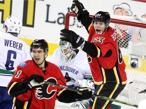 Calgary Flames centre Sam Bennett turned to celebrate after teammate T.J. Brodie scored the Flames' second goal of the game on Sunday. Bennett later tallied what would stand up as the game winner in a 4-2 triumph.