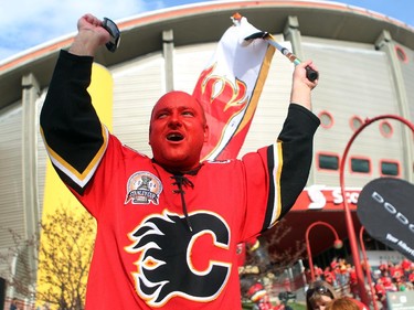 Colleen De Neve/ Calgary Herald CALGARY, AB --APRIL 21, 2015 -- Longtime hockey fan Nigel Green broke out his 2004 costume and painted his face as he got geared up for Game 4 of the playoffs between the Calgary Flames and the Vancouver Canucks at the Scotiabank Saddledome on April 21, 2015. (Colleen De Neve/Calgary Herald) (For City story by Val Fortney) 00064508A SLUG: 0422-Flames Fans Pandemonium ORG XMIT: A65W7222.JPG
