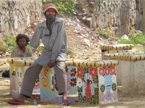 Om Pal, a deaf/mute former beggar with one arm who makes these beautiful tile mosaics throughout DelhiÕs historic Hazrat Nizamuddin Basti. He was given this work by the Aga Khan Trust for Culture, which is involved in the renewal of the basti. /Calgary Herald) For  Trax #