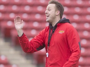 New Dinos offensive co-ordinator Ryan Sheahan, directs drills at the team's spring football camp at McMahon Stadium, which continues until Sunday.