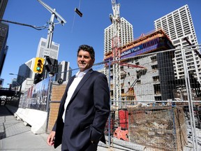 Joe Binfet, managing director/broker for Colliers International, near the Brookfield Place tower under construction in Calgary.