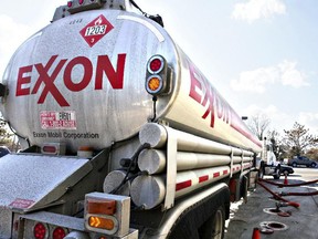 An Exxon tanker truck makes a refueling stop at an Exxon station in Arlington, Va.
