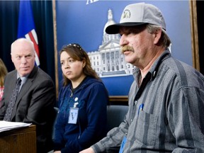 Farmworkers Union president Eric Musekamp, right, Kevan Chandler's widow, Lorna, and former Liberal agricultural critic Kevin Taft, talk about the fight for farm workers' legislation back in 2009.