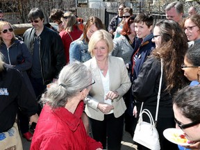 Alberta NDP Leader Rachel Notley talks with supporters during a backyard gathering in Edmonton on Sunday April 26, 2015.