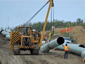 Workers assemble the Enbridge pipeline to Hardisty southeast of New Sarepta in September 2014.
