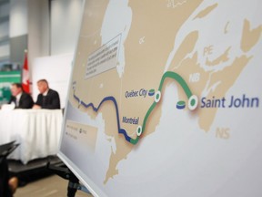 TransCanada president and CEO Russ Girling, right, and president of Energy and Oil Pipelines  Alex Pourbaix speak at their company's announcement of an Energy East Pipeline project on August 1, 2013.