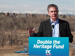 PC Leader Jim Prentice announces his government would increase contributions to the Heritage Trust Fund during a campaign stop above Fish Creek Provincial park in Calgary on April 10, 2015.