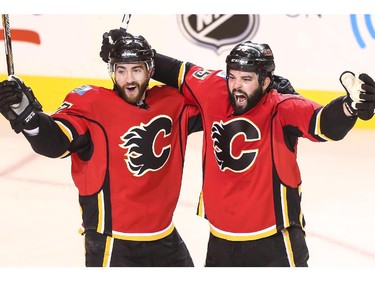 Calgary Flames Brandon Bollig, right, celebrates the first goal of game three with J Brodie during playoff action against the Vancouver Canucks at the Saddledome in Calgary, on April 19, 2015.