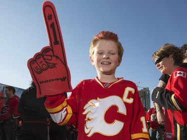 Logan Nicholson joins the sea of red before attending his first playoff fame outside the Saddledome before the Flames first playoff home game in six years in Calgary, on April 19, 2015. --