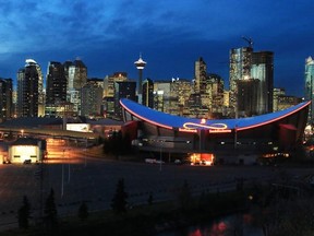 Scotiabank Saddledome with downtown Calgary in the background. (skyline, dusk) Gavin Young/Calgary Herald (For City section story by ) Trax#