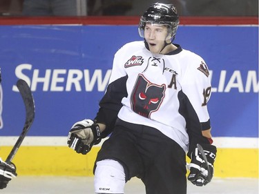 Calgary Hitmen's Adam Tambellini celebrates after scoring the Hitmen's first goal of the game and tying it up during WHL playoff action against the Brandon Wheat Kings at the Saddledome in Calgary, on April 28, 2015.
