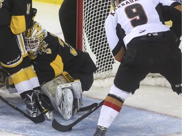 Brandon Wheat Kings' goalie Jordan Papirny can't quite keep this shot from Calgary Hitmen's Pavel Karnaukhov out during WHL playoff action at the Saddledome in Calgary, on April 28, 2015. The goal was disallowed. --  (Crystal Schick/Calgary Herald) (For Sports story by  TBA) 00064744A