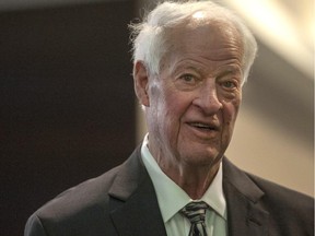 Hockey legend Gordie Howe leaves his hotel on his way tribute to him in Saskatoon, Friday, February 6, 2015.