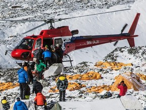 A helicopter prepares to rescue people at Everest Base Camp, Nepal.