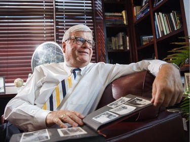 George Brookman, owner of West Canadian Graphics, reminisces about his childhood in his office in Calgary on Thursday, April 2, 2015.