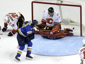 St. Louis Blues' Jaden Schwartz scores past Calgary Flames goalie Jonas Hiller in the first period.