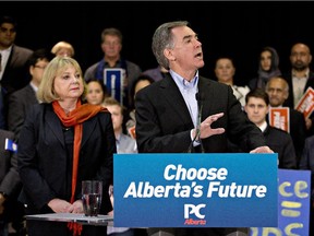 Reader says the election called by Premier Jim Prentice, seen here with wife, Karen, is a waste of money.