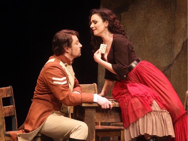 Sandra Piques Eddy as Carmen flirts with Antoine Belanger in the role of Don Jose during the dress rehearsal of the Calgary Opera production at the Jubilee Thursday April 16, 2015.