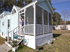Karen and Tom Rogers look out of their  tiny home in Virginia. Reader hopes a similar development will take root in Alberta.