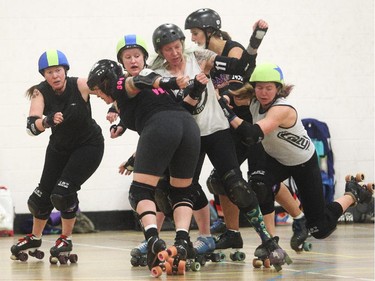 The women of the All Star Team with the Calgary Roller Derby Association, and their elbows, mix it up during a scrimmage Thursday April 16, 2015 at the West Hillhurst Community Centre. The team is going to South Carolina next week for Southern discomfort tournament. The league's regular season opens Saturday night at the Triwood Community Association with both the B52 Bellas and the Cut Throat Car Hops in action.