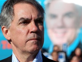 Premier Jim Prentice listened to questions from reporters during a scrum after he took part in an all-candidates debate for his riding of Calgary-Foothills on April 18, 2015.