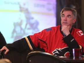 Premier Jim Prentice donned his Flames jersey after a long day of campaigning and watched the first Flames Canucks playoff game from Medicine Hat on April 15, 2015.