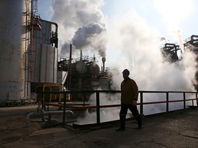 An Iranian oil worker is pictured at an oil refinery south of  Tehran.