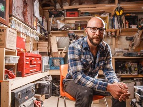 Aron Hill creates art in his basement studio in Calgary.