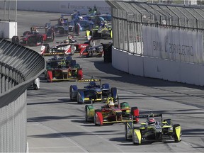Nelson Piquet Jr., of Brazil, leads the pack at the start of the Formula E Long Beach ePrix auto race, Saturday, April 4, 2015, in Long Beach, Calif.