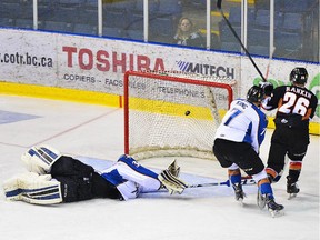 Connor Rankin scores one of his three goals on Kootenay Ice goalie Wyatt Hoflin in Cranbrook, B.C. on Wednesday night. The Hitmen won 7-2 in Game 4  to take a commanding 3-1 series lead.