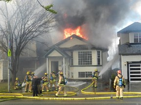 Fire crews were called to a blaze in the 10700 block of Hidden Valley Drive N.W. around 5 p.m. on Monday, April 20, 2015. The two-alarm fire affected four homes.