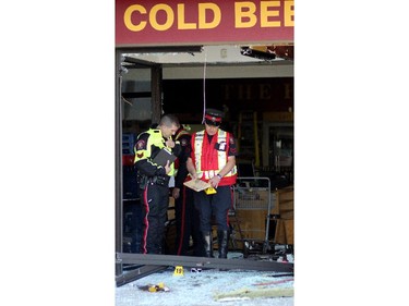 Police at the scene of a smash and grab at a Liquor Depot in Ogden.