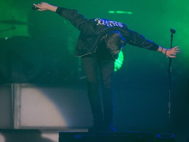 One Republic lead singer Ryan Tedder takes a bow after a song during their concert at the Saddledome in Calgary, on April 30, 2015.