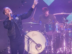 OneRepublic lead singer Ryan Tedder rocks the Saddledome with drummer Eddie Fisher in Calgary, on April 30, 2015.