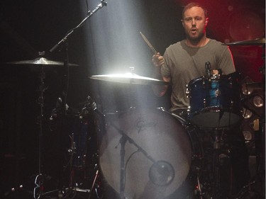 A beam of light hits the drum set of Brent Kutzle of One Republic during their concert at the Saddledome in Calgary, on April 30, 2015.